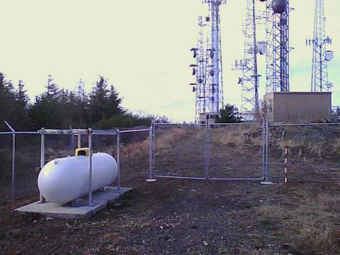 This is the view of our front door camera. The 500 gallon LP gas tank is on the left and the "snow-stick" is to the right of the gate. The top of the "snow-stick" is four feet with descending six-inch sections alternating red and white.